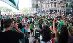 People Celebrating In Green Image