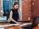 Entrepreneurship - Woman Standing At Desk Image