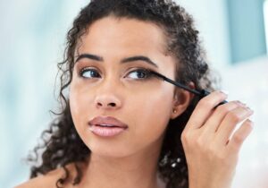 woman applying makeup